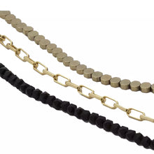 Cargar imagen en el visor de la galería, Collar triple de Ónix, Hematita y cadena con dijes de Ojo Protector y Galleta de Mar. Aretes a juego incluídos.