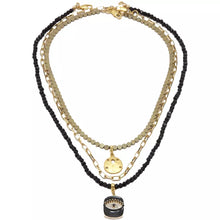 Cargar imagen en el visor de la galería, Collar triple de Ónix, Hematita y cadena con dijes de Ojo Protector y Galleta de Mar. Aretes a juego incluídos.
