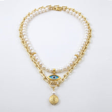 Cargar imagen en el visor de la galería, Collar doble de Perla y cadena con dijes de Ojo Protector y Mandala. Aretes a juego incluídos