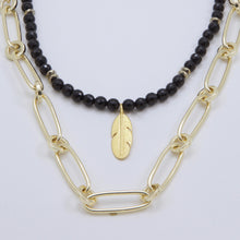 Load image into Gallery viewer, Double necklace with Onyx and chain with feather pendant. Matching earrings included.
