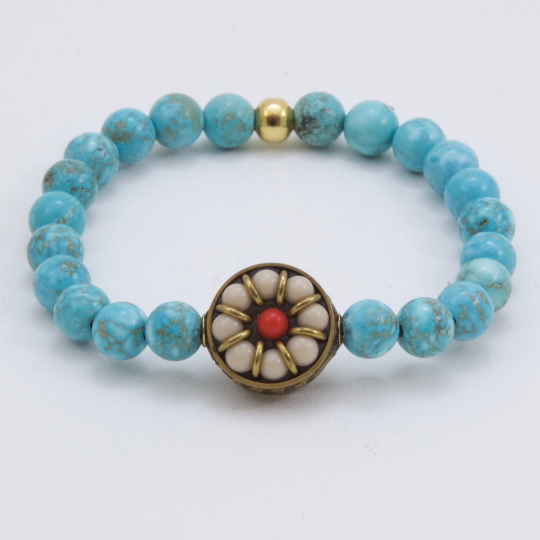 Turquoise bracelet with Agate and Coral charm.