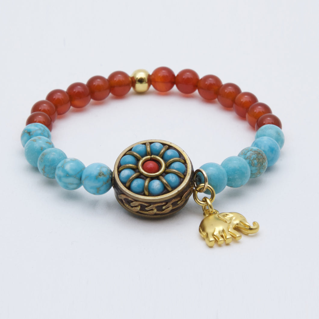 Turquoise and Carnelian bracelet with Turquoise and Coral charm with elephant.