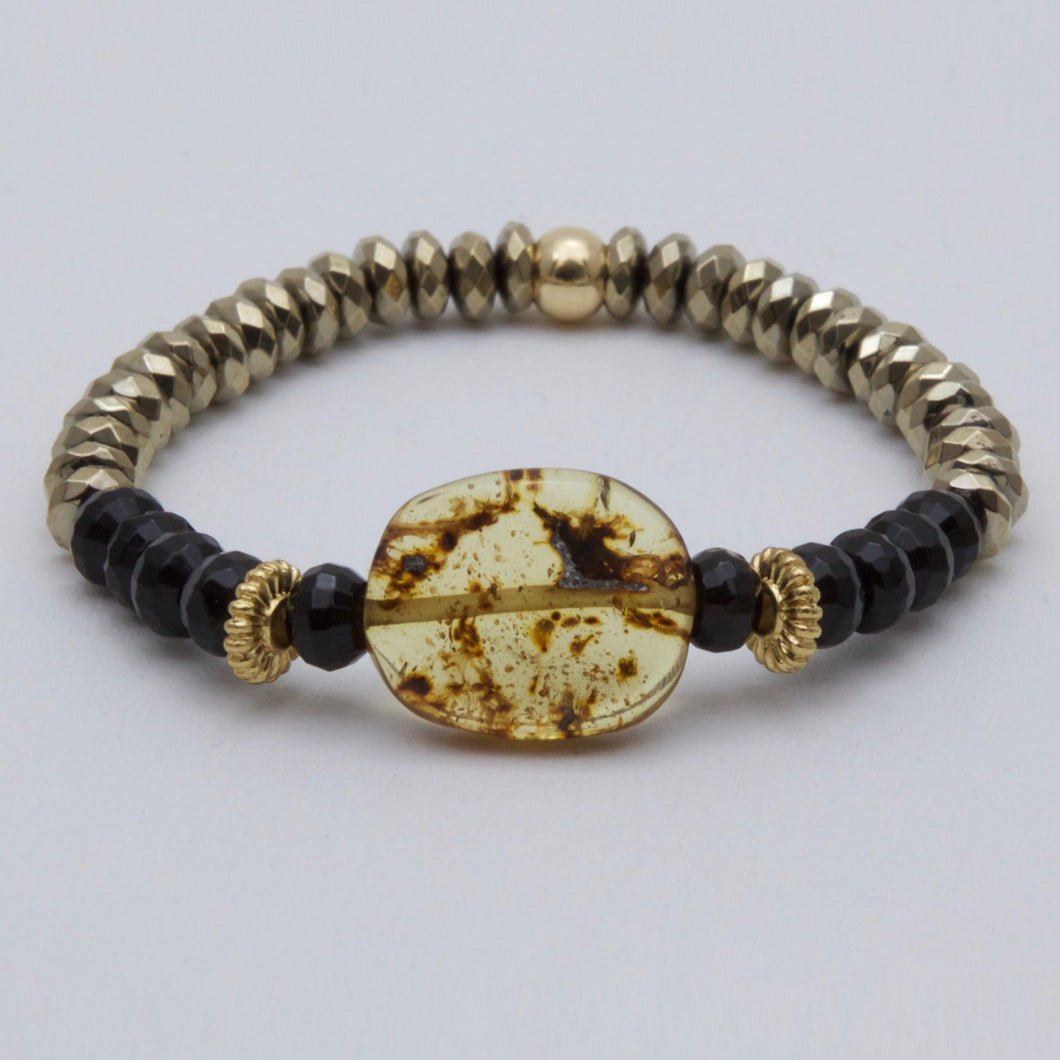 Onyx and Hematite bracelet with Amber center piece.