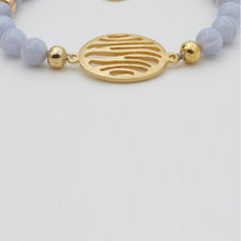 Load image into Gallery viewer, Blue Lace Agate Bracelet with oval zebra charm with spiral snail.
