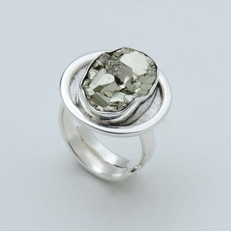 Adjustable ring with oval Pyrite. Round bezel